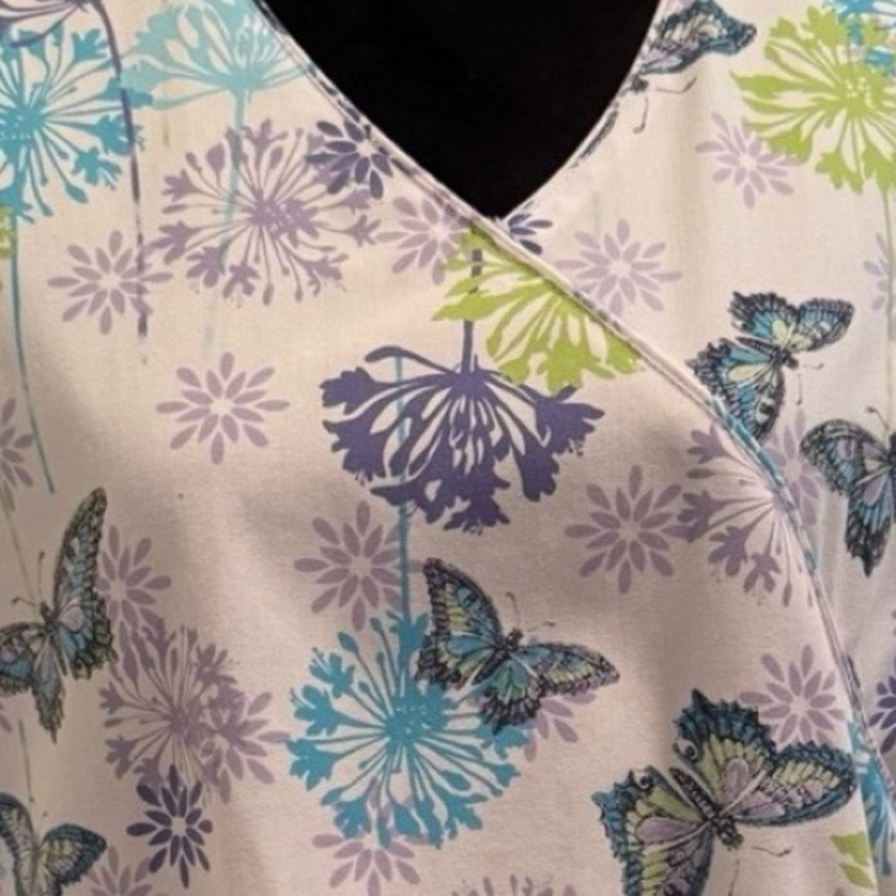 Floral Butterfly Print Women's scrub top. Just in time for spring.